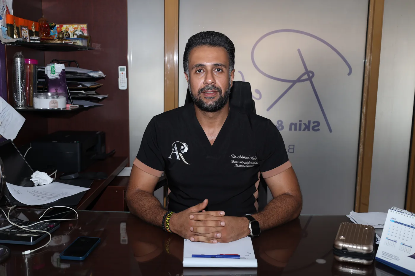 Refine Skin & Body Clinic consultant at his desk